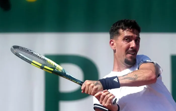 Thanasi Kokkinakis roars back to win trademark five-set classic at French Open