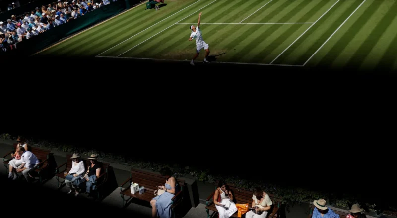 Serves, strawberries and shadows: Tom Jenkins’ best shots of Wimbledon 2026 – in pictures